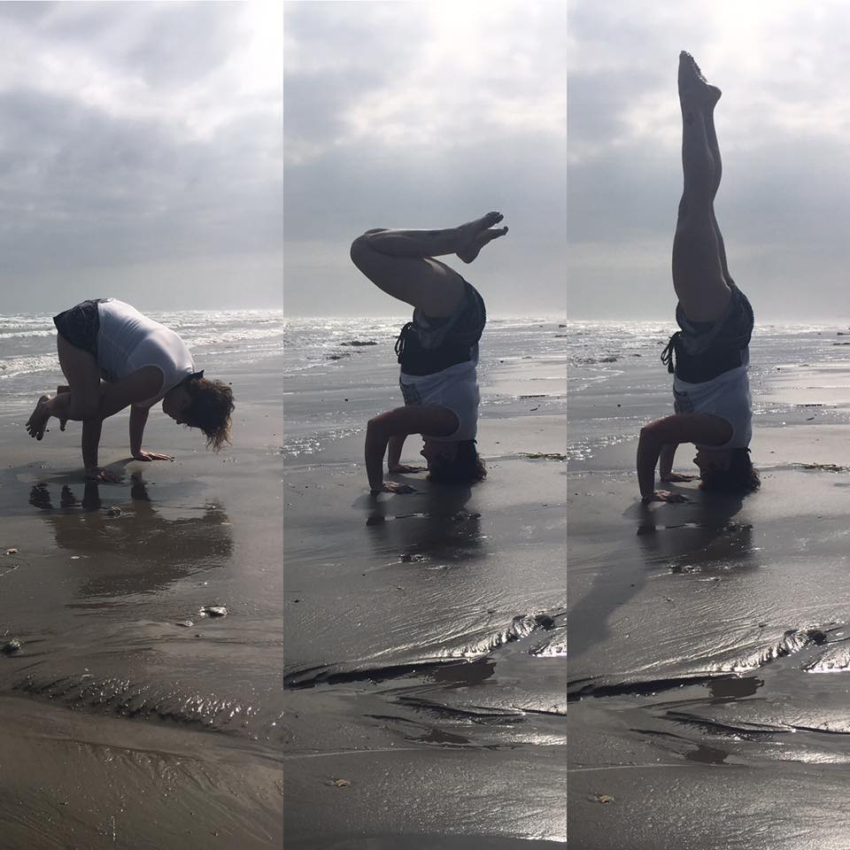 Aleks Phillips headstand on beach